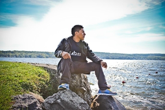 Erik Yax Sits on a Rock